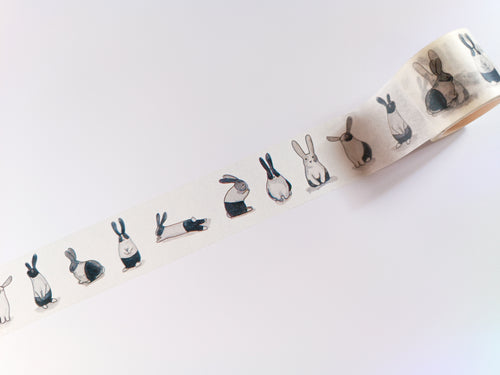 A roll of Monochrome Rabbit Washi Tape by GretelCreates with a picture of rabbits on it.