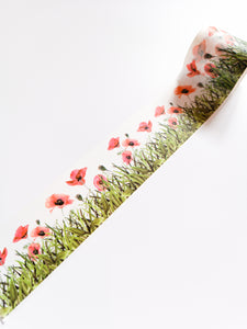 A roll of Poppy Field Washi Tape with red poppies on it, from the GretelCreates brand.