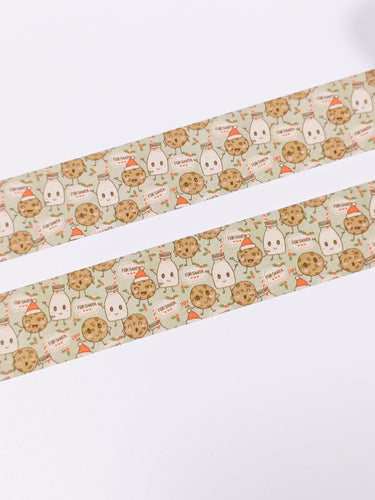 Two strips of Milk and Cookies For Santa Christmas Washi Tape by GretelCreates with a cat and a dog on them.