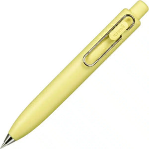 A yellow Uni-Ball One P - Pocket Pen with a metal clip on a white background.