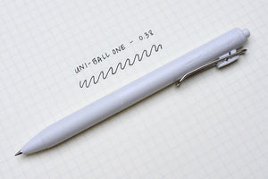 A white Limited Edition Uni-ball One Japanese Taste Pastel Colours - 0.5MM pen with writing on it on a piece of paper.