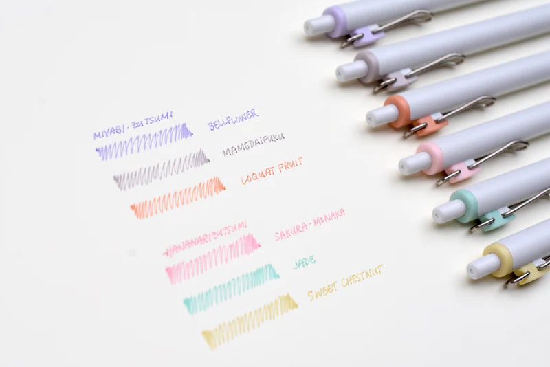A group of Limited Edition Uni-ball One Japanese Taste Pastel Colours - 0.5MM pens on a white surface.