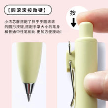 Load image into Gallery viewer, A person is holding a yellow Uni-Ball One P - Pocket Pen in Various Colours with chinese writing on it.