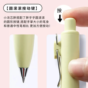 A person is holding a yellow Uni-Ball One P - Pocket Pen in Various Colours with chinese writing on it.