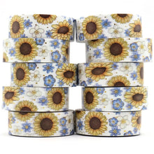 Load image into Gallery viewer, A stack of Gold Foil Sunflower Washi Tape and Blue &amp; White Flower Decorative Tape by GretelCreates on a white background.