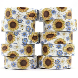 A stack of Gold Foil Sunflower Washi Tape and Blue & White Flower Decorative Tape by GretelCreates on a white background.