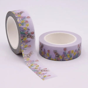 A roll of Gold Foil Spring Bunny Washi Tape with Spring Daffodils & Tulips on it, by GretelCreates.