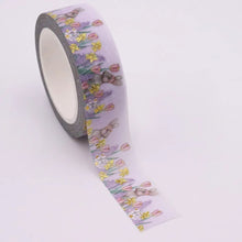Load image into Gallery viewer, A roll of Gold Foil Spring Bunny Washi Tape by GretelCreates with an image of bunnies and flowers.