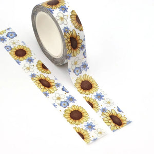 A roll of Gold Foil Sunflower Washi Tape and Blue & White Flower Decorative Tape by GretelCreates was on a white surface.