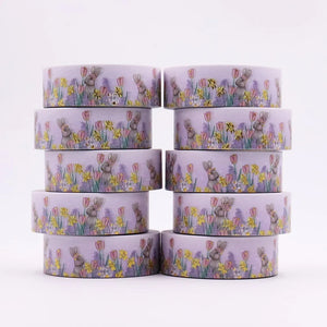 A stack of Gold Foil Spring Bunny Washi Tape, Spring Daffodils & Tulips Decorative Tape with flowers on it by GretelCreates.