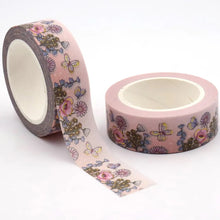 Load image into Gallery viewer, A roll of Gold Foil Summer Flowers Washi Tape by GretelCreates with Pink Daisy Decorative Tape on it.