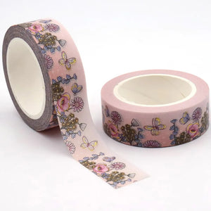 A roll of Gold Foil Summer Flowers Washi Tape by GretelCreates with Pink Daisy Decorative Tape on it.