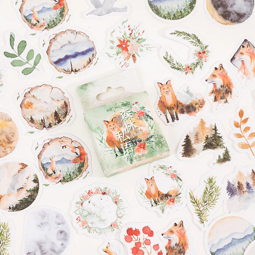 A bunch of Watercolour Forest Fox Scrapbook Sticker Flakes, 46 pcs Woodland Animals Journaling Stickers by GretelCreates with foxes and trees on them.