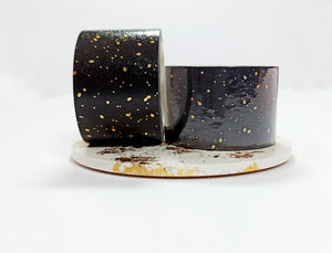 Two Minimal Gold Speckle 10mm Foil Washi Tapes from the UK Washi Shop displayed on a white plate.