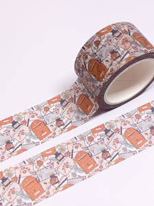 A roll of Vintage Style Happy Mail Washi Tape - 30mm with an orange and brown pattern created by GretelCreates.