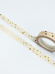 A roll of 10mm gold foil GretelCreates Washi Tape with peach and gold stars.