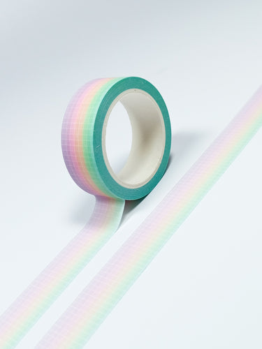 A Pastel Ombre Grid washi tape by GretelCreates on a white surface.